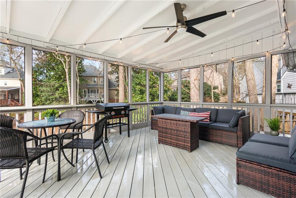 413 Sassafras Road Roswell, GA 30076 - Photo 18 of 67 a living room with furniture and a large window