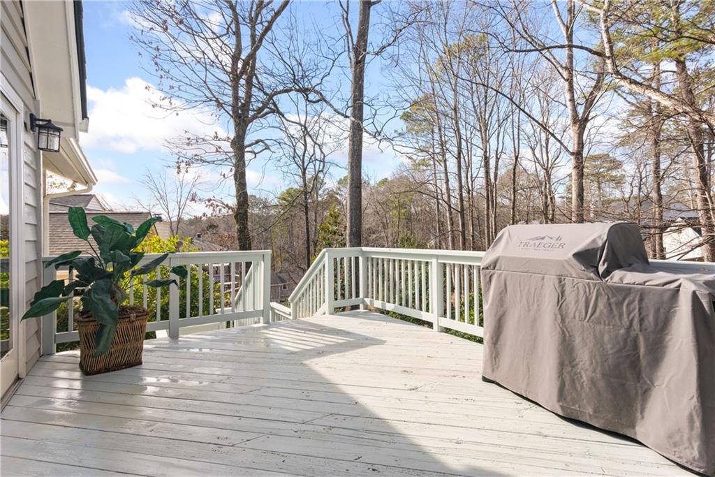413 Sassafras Road Roswell, GA 30076 - Photo 19 of 67 a view of a wooden deck with chairs