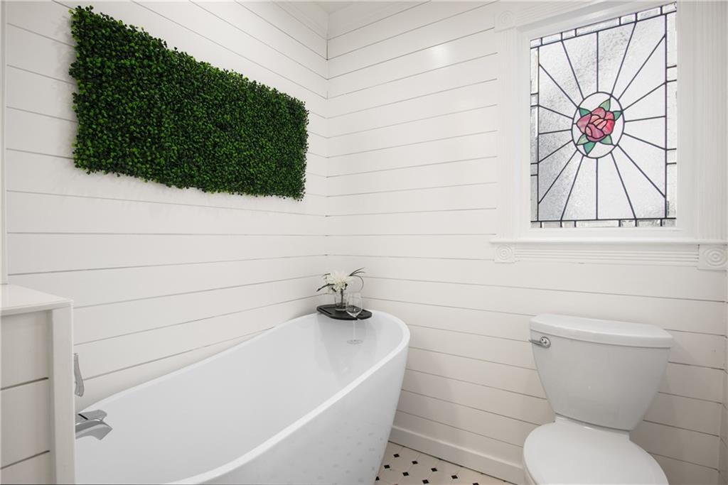 413 Sassafras Road Roswell, GA 30076 - Photo 25 of 67 a bathroom with a toilet and a bathtub