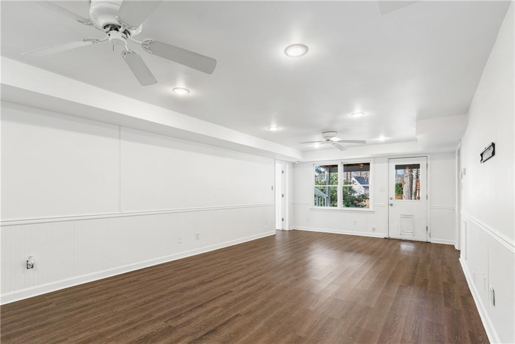 413 Sassafras Road Roswell, GA 30076 - Photo 34 of 67 an empty room with wooden floor and windows