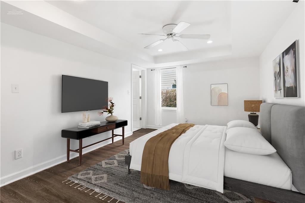 413 Sassafras Road Roswell, GA 30076 - Photo 37 of 67 a bedroom with a bed and a flat screen tv