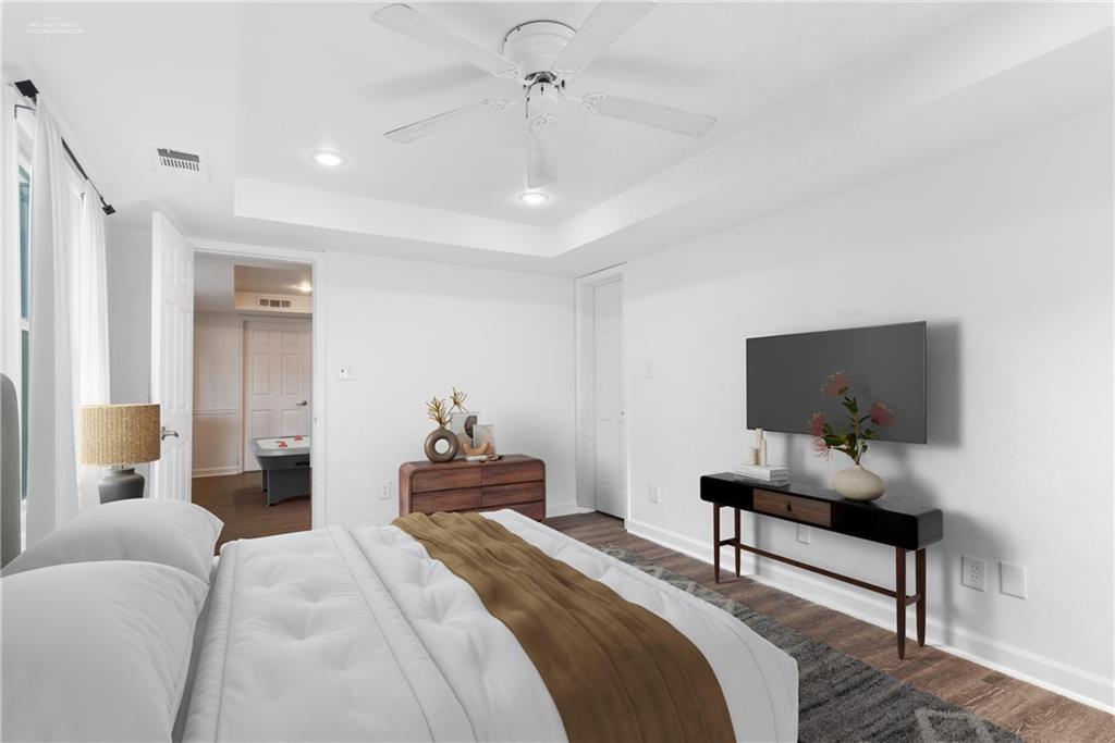 413 Sassafras Road Roswell, GA 30076 - Photo 39 of 67 a bedroom with bed and a flat screen tv