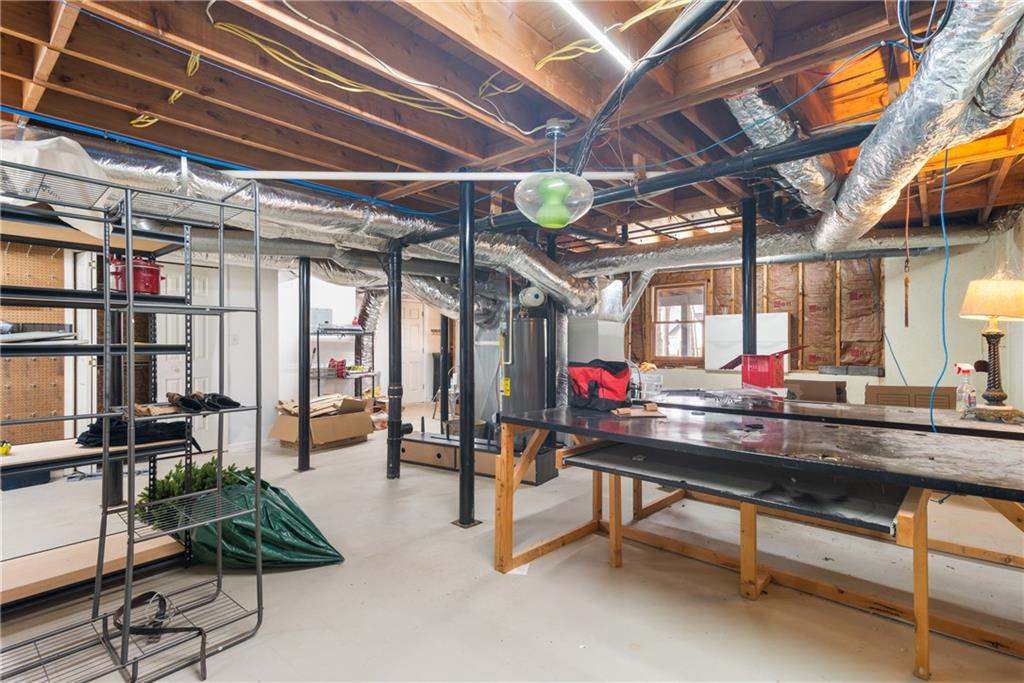 413 Sassafras Road Roswell, GA 30076 - Photo 46 of 67 a room with lots of furniture and a potted plant