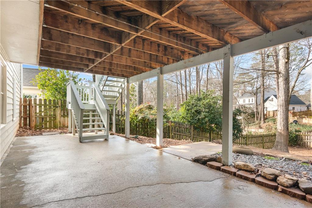 413 Sassafras Road Roswell, GA 30076 - Photo 47 of 67 a view of a room with wooden floor and iron stairs