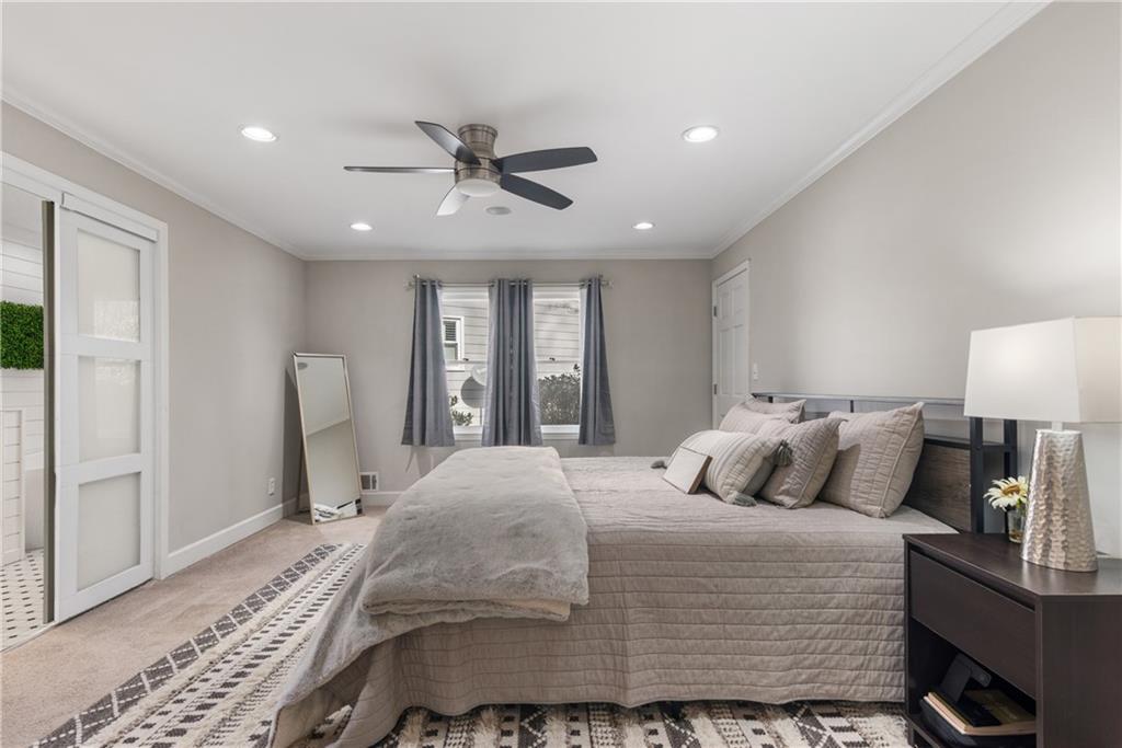 413 Sassafras Road Roswell, GA 30076 - Photo 7 of 67 a bedroom with a large bed and a window