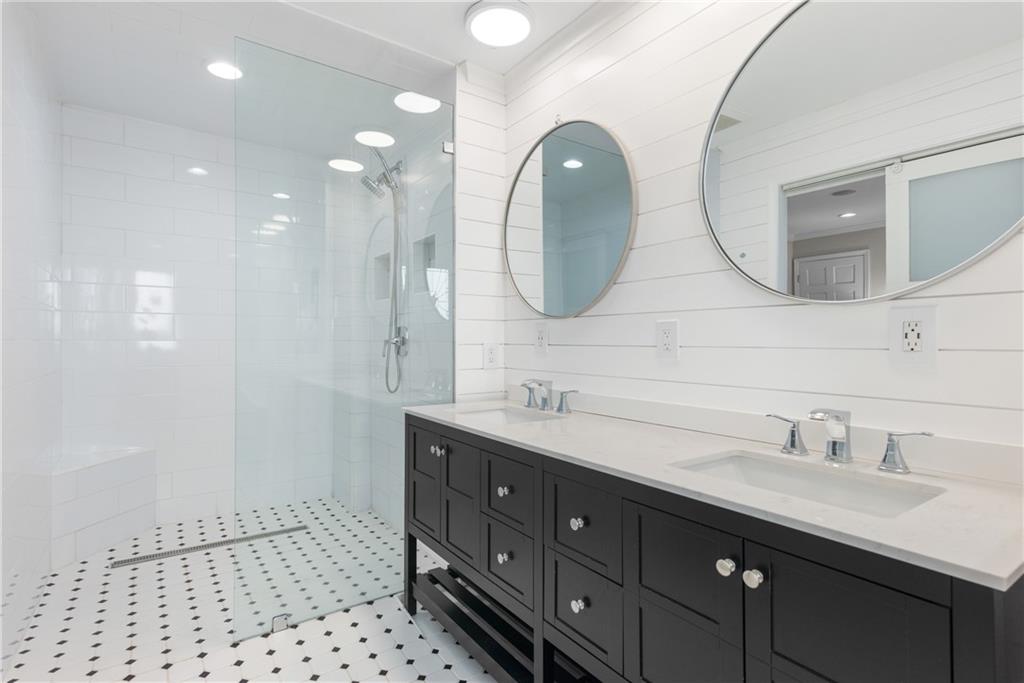 413 Sassafras Road Roswell, GA 30076 - Photo 9 of 67 a bathroom with a double vanity sink and a mirror