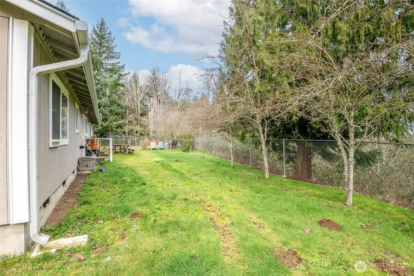 a backyard of a house with lots of green space