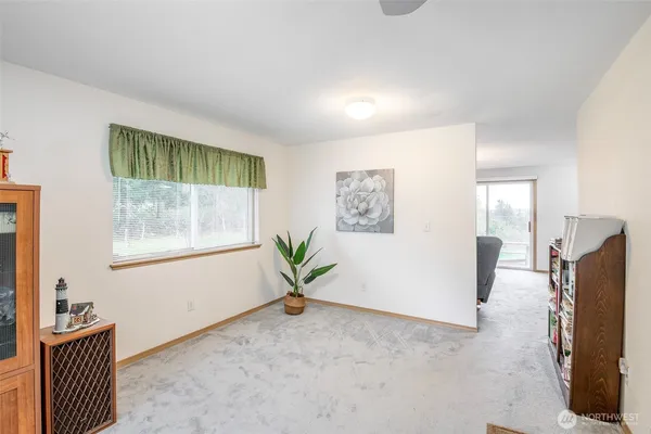 a view of an empty room with a window