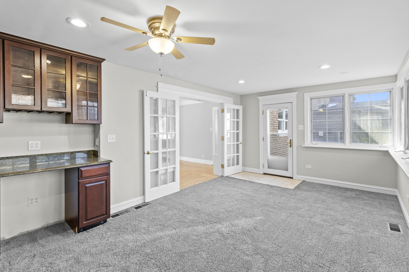 727 Selborne Road Riverside, IL 60546 - Photo 11 of 15 a view of an empty room with a window and a kitchen