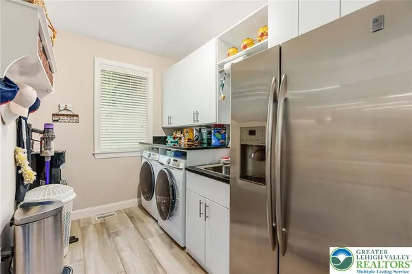 a kitchen with a refrigerator and a stove