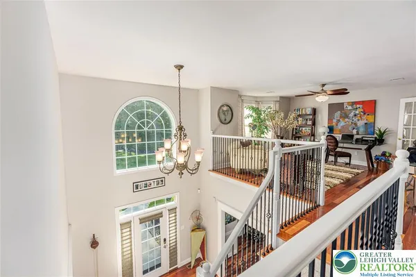 a view of a living room and balcony