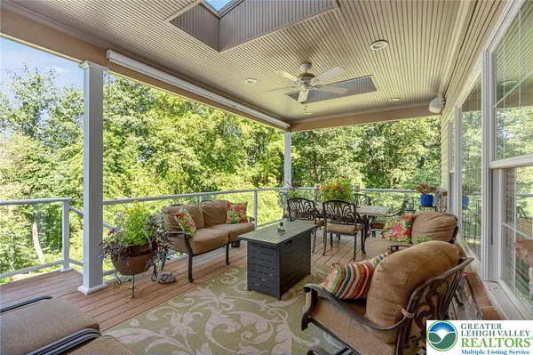 a view of a patio with table and chairs and potted plants