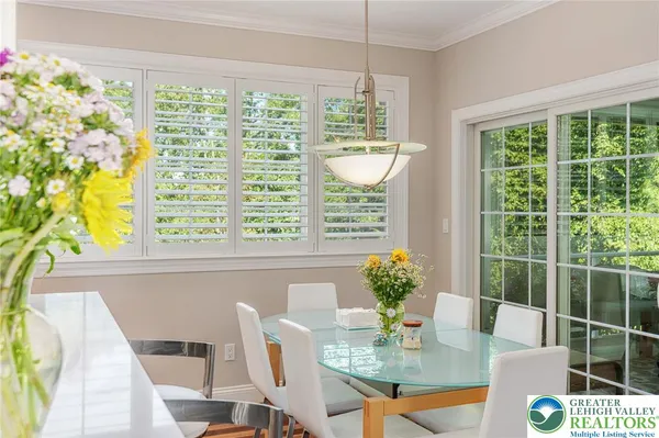 a view of a dining room with furniture window and outside view