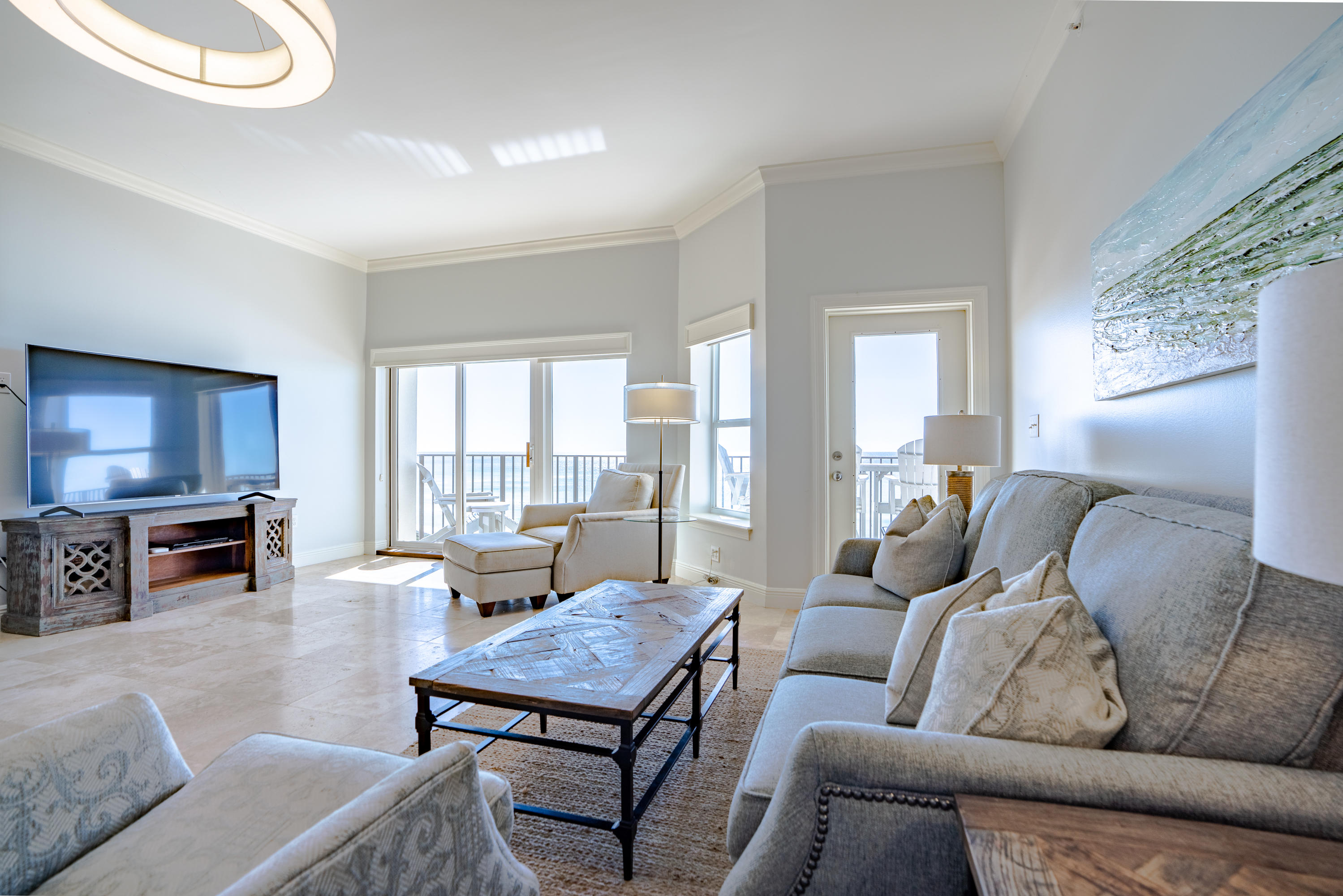 3880 East County Highway 30A, Unit 402 Santa Rosa Beach, FL 32459 - Photo 11 of 62 a living room with furniture a flat screen tv and a large window