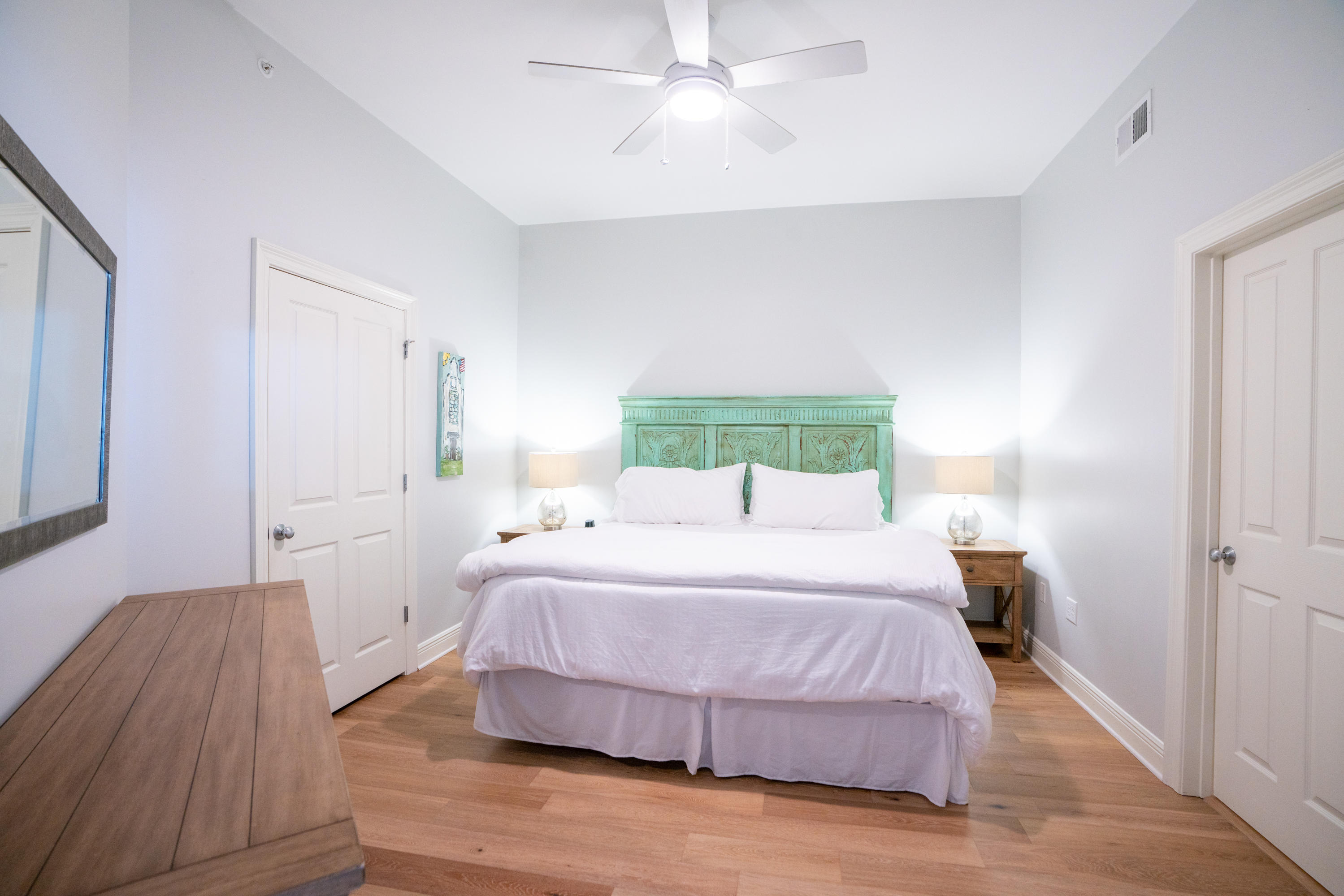 3880 East County Highway 30A, Unit 402 Santa Rosa Beach, FL 32459 - Photo 18 of 62 a bedroom with a bed and wooden floor