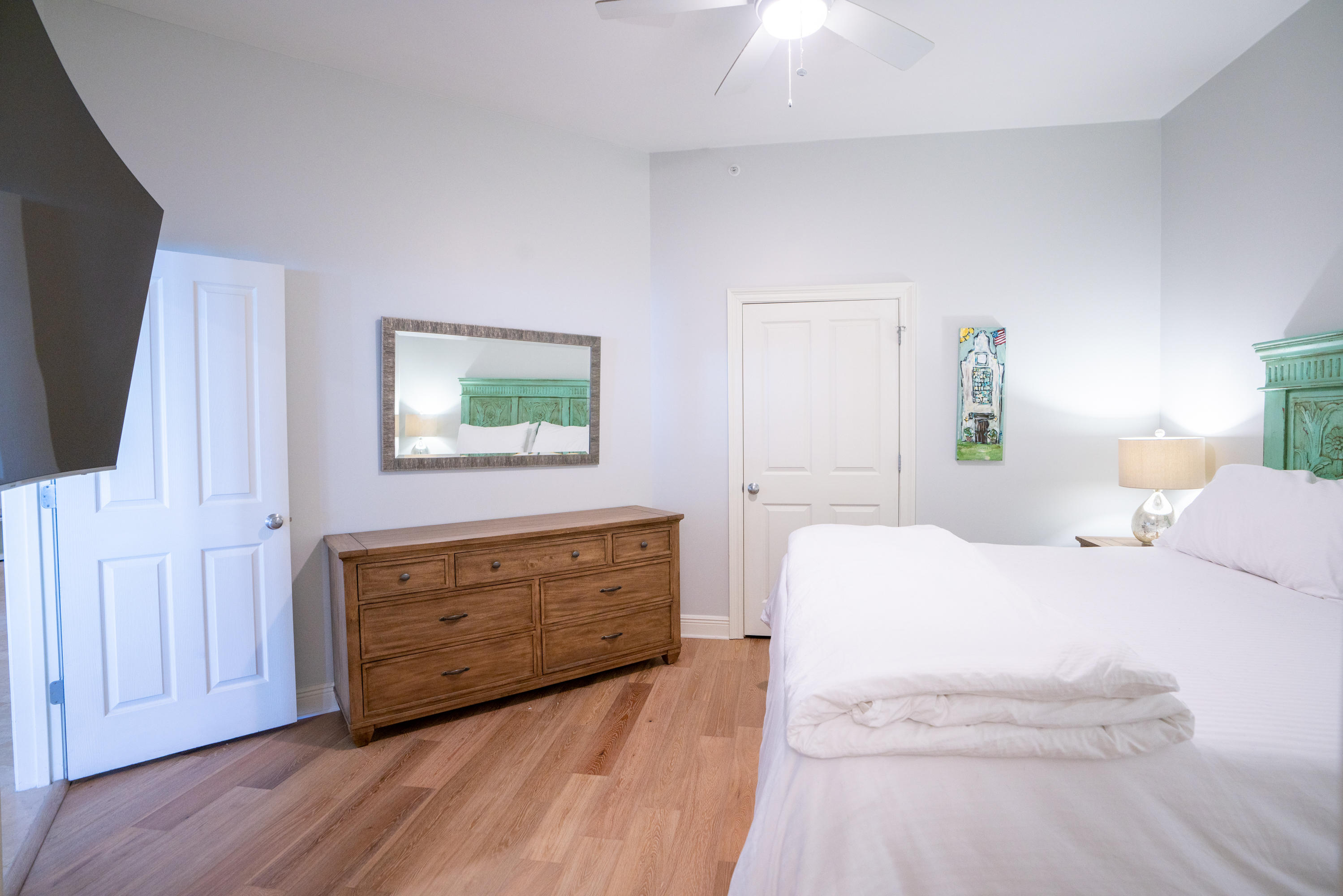 3880 East County Highway 30A, Unit 402 Santa Rosa Beach, FL 32459 - Photo 20 of 62 a bedroom with a bed windows and a flat screen tv