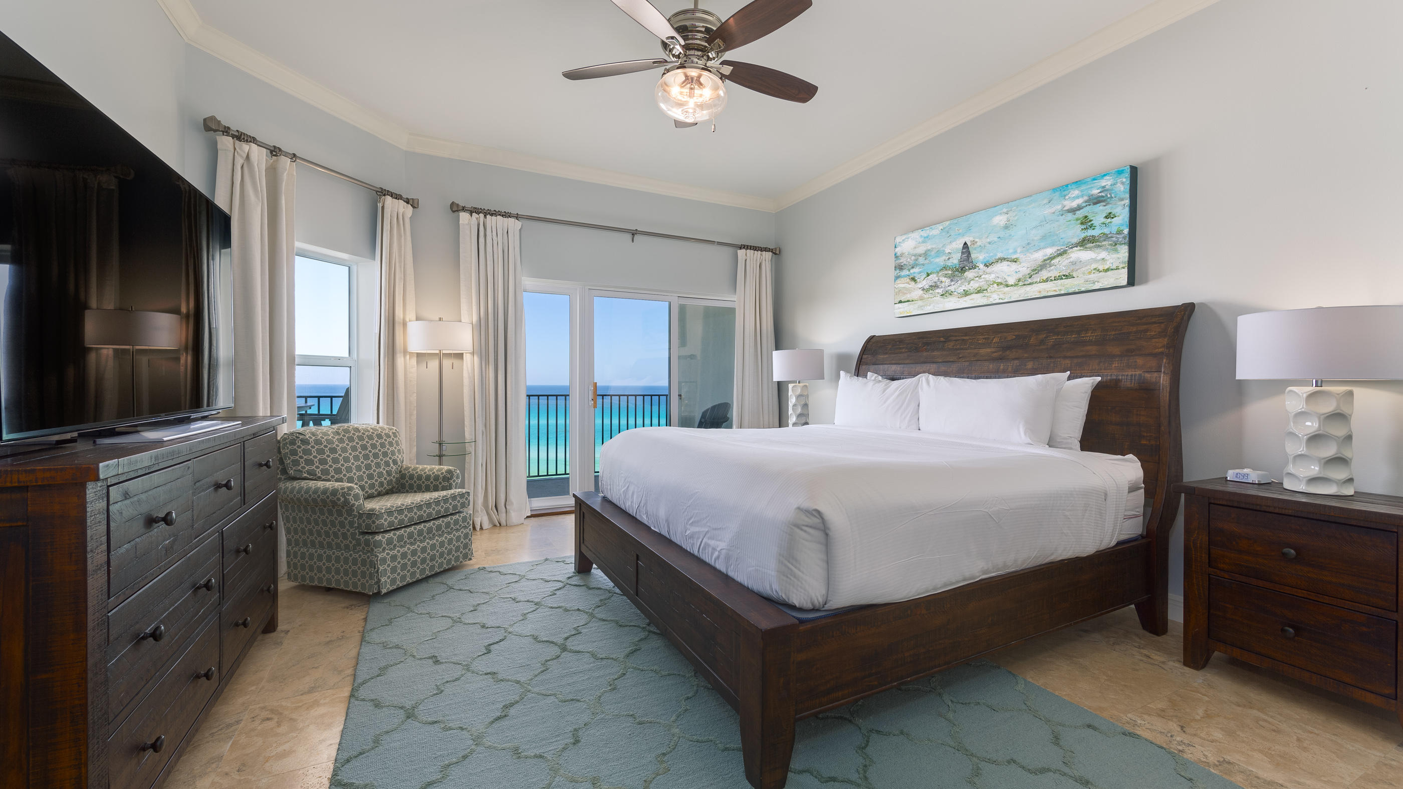 3880 East County Highway 30A, Unit 402 Santa Rosa Beach, FL 32459 - Photo 2 of 62 a spacious bedroom with a bed and a flat screen television