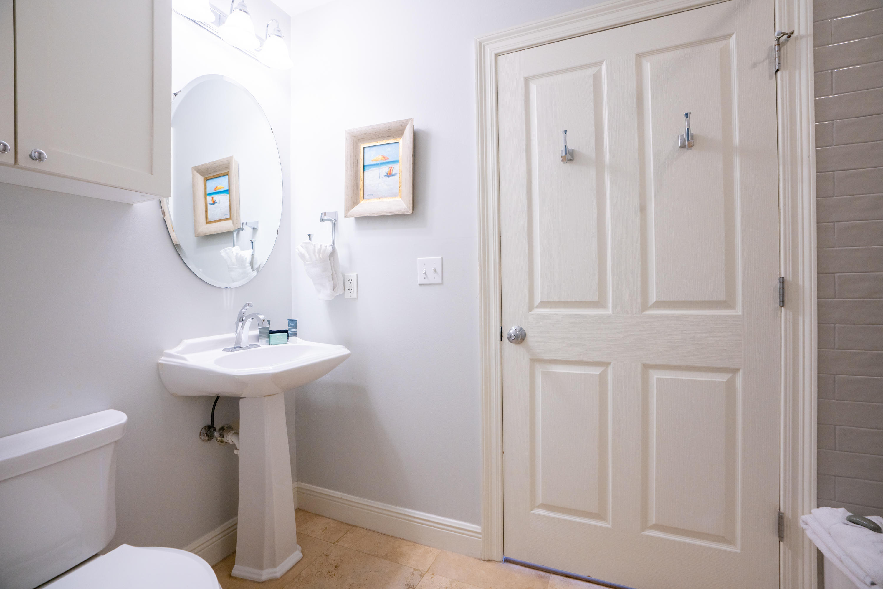 3880 East County Highway 30A, Unit 402 Santa Rosa Beach, FL 32459 - Photo 22 of 62 a bathroom with a sink a toilet and mirror