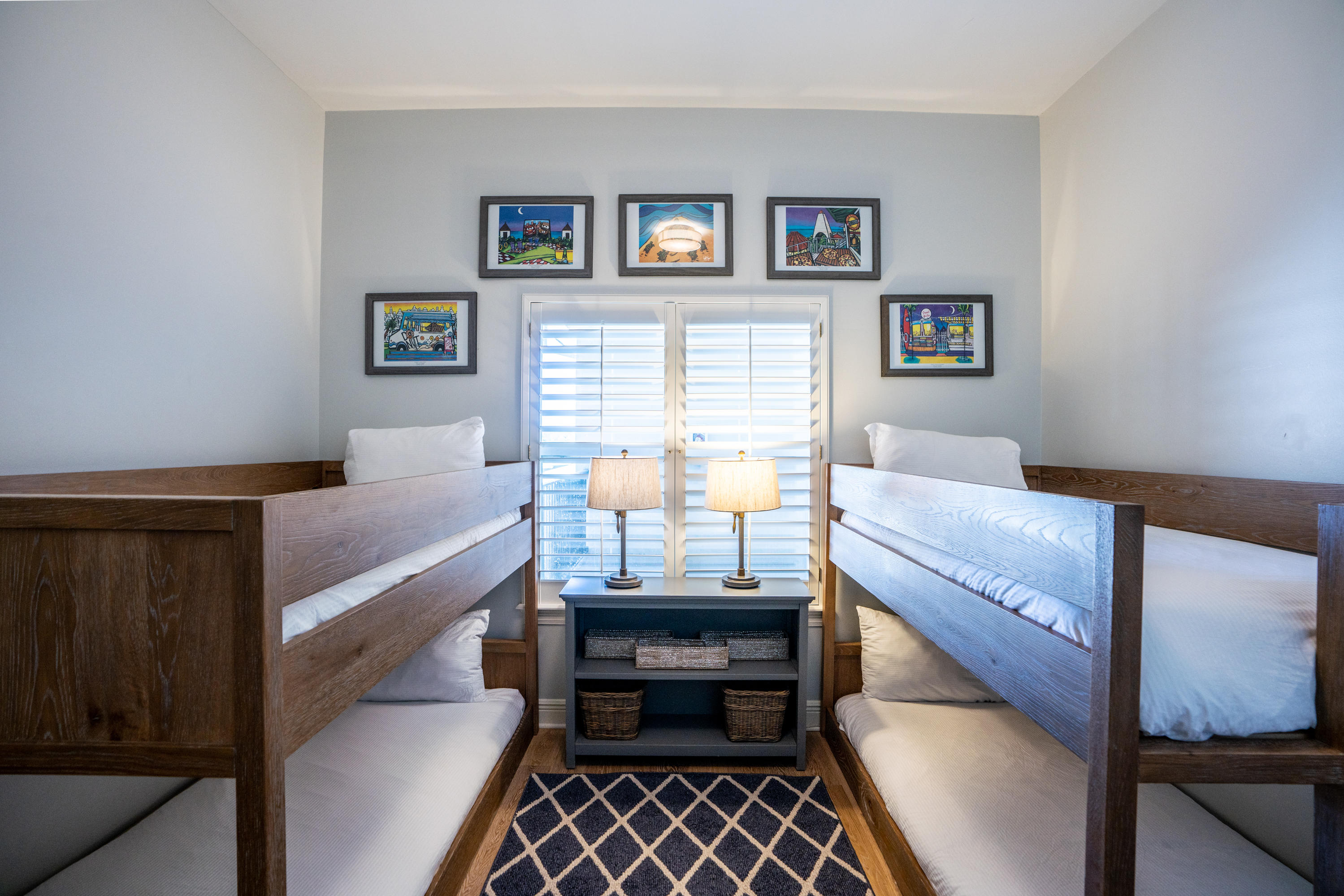 3880 East County Highway 30A, Unit 402 Santa Rosa Beach, FL 32459 - Photo 26 of 62 a room with a bed and a bookshelf with wooden floor