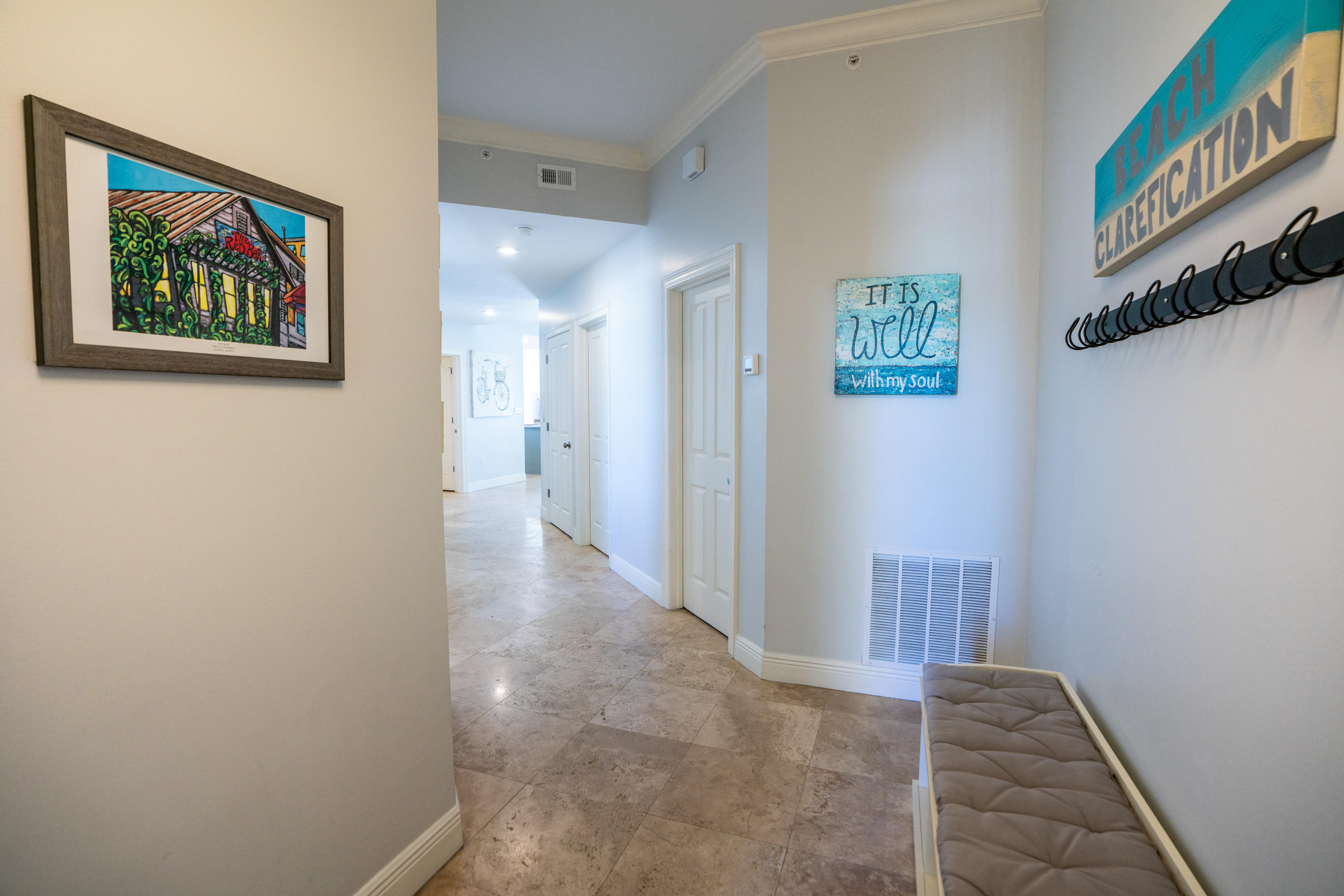 3880 East County Highway 30A, Unit 402 Santa Rosa Beach, FL 32459 - Photo 29 of 62 a view of a hallway with paintings on the wall
