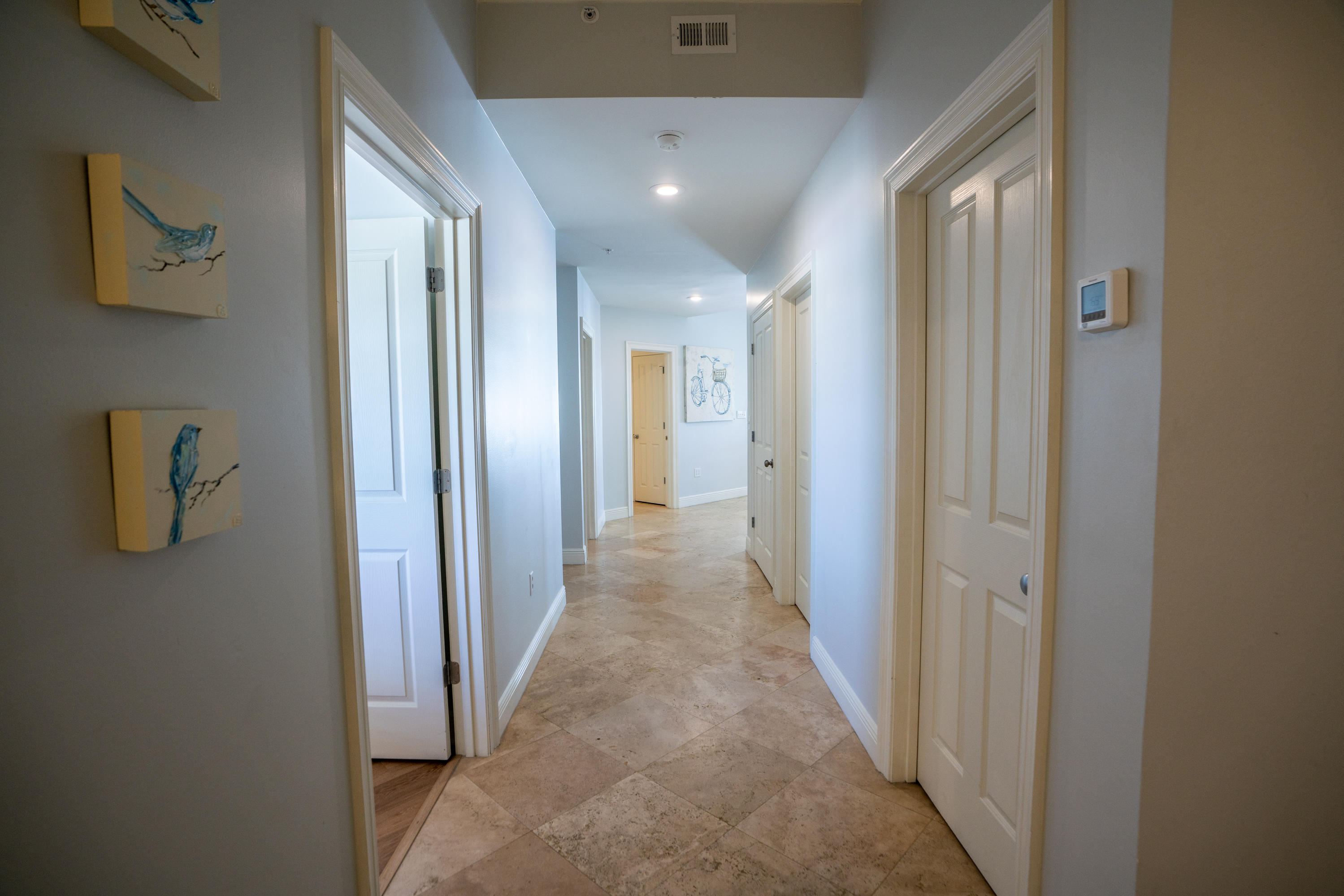 3880 East County Highway 30A, Unit 402 Santa Rosa Beach, FL 32459 - Photo 30 of 62 a view of a hallway with wooden shelves
