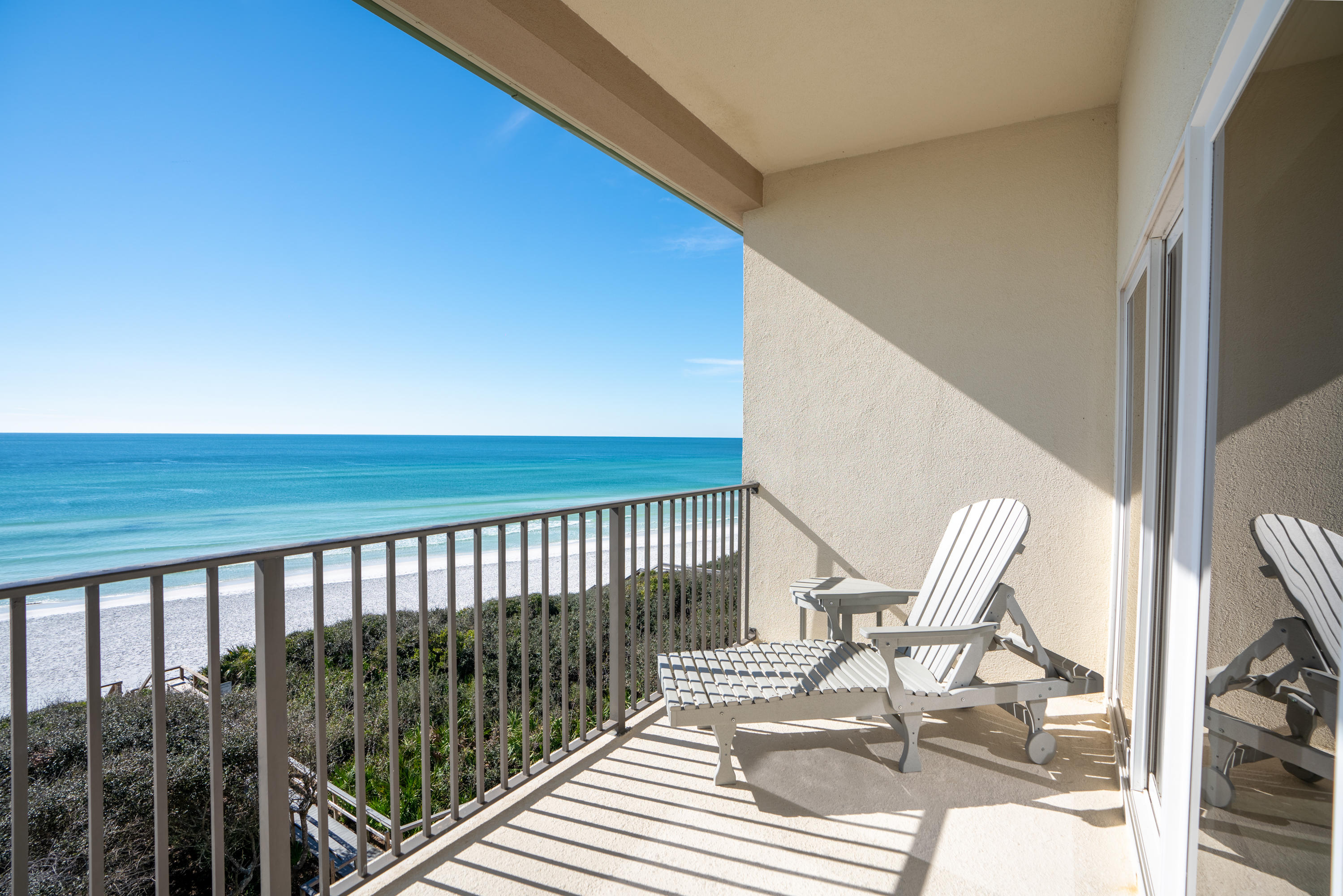 3880 East County Highway 30A, Unit 402 Santa Rosa Beach, FL 32459 - Photo 35 of 62 a view of balcony with wooden floor and outdoor seating