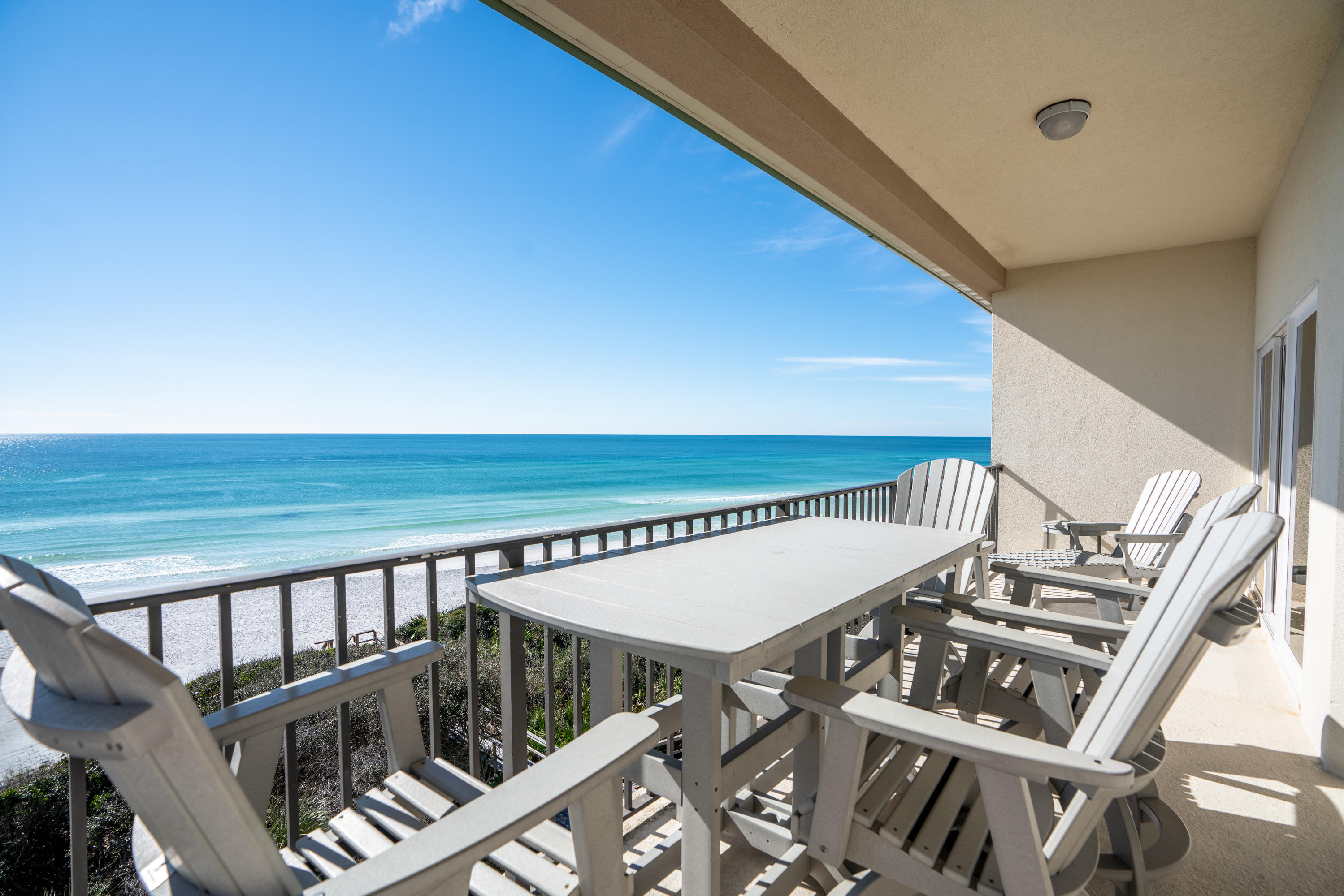 3880 East County Highway 30A, Unit 402 Santa Rosa Beach, FL 32459 - Photo 36 of 62 a view of a balcony with wooden floor and stairs