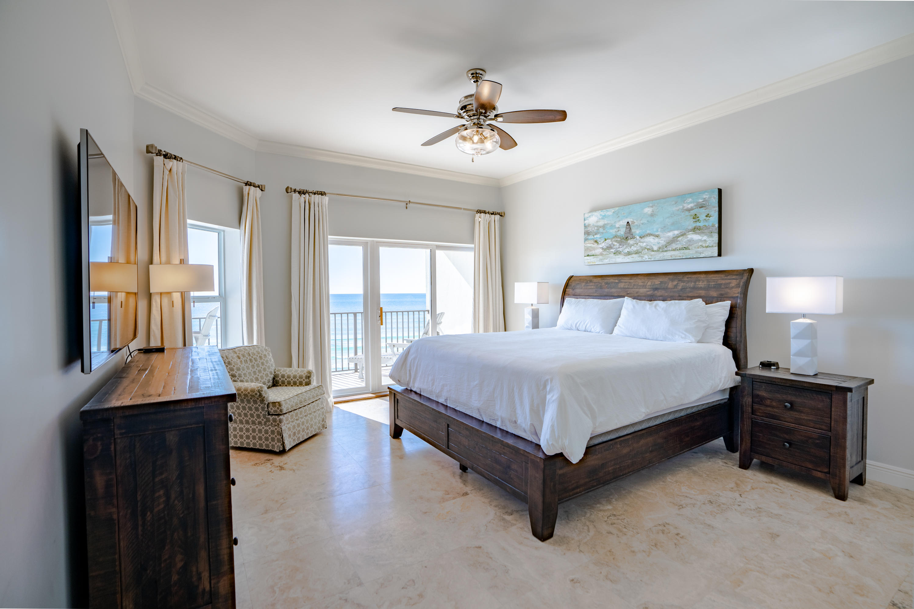 3880 East County Highway 30A, Unit 402 Santa Rosa Beach, FL 32459 - Photo 4 of 62 a spacious bedroom with a bed and a chandelier