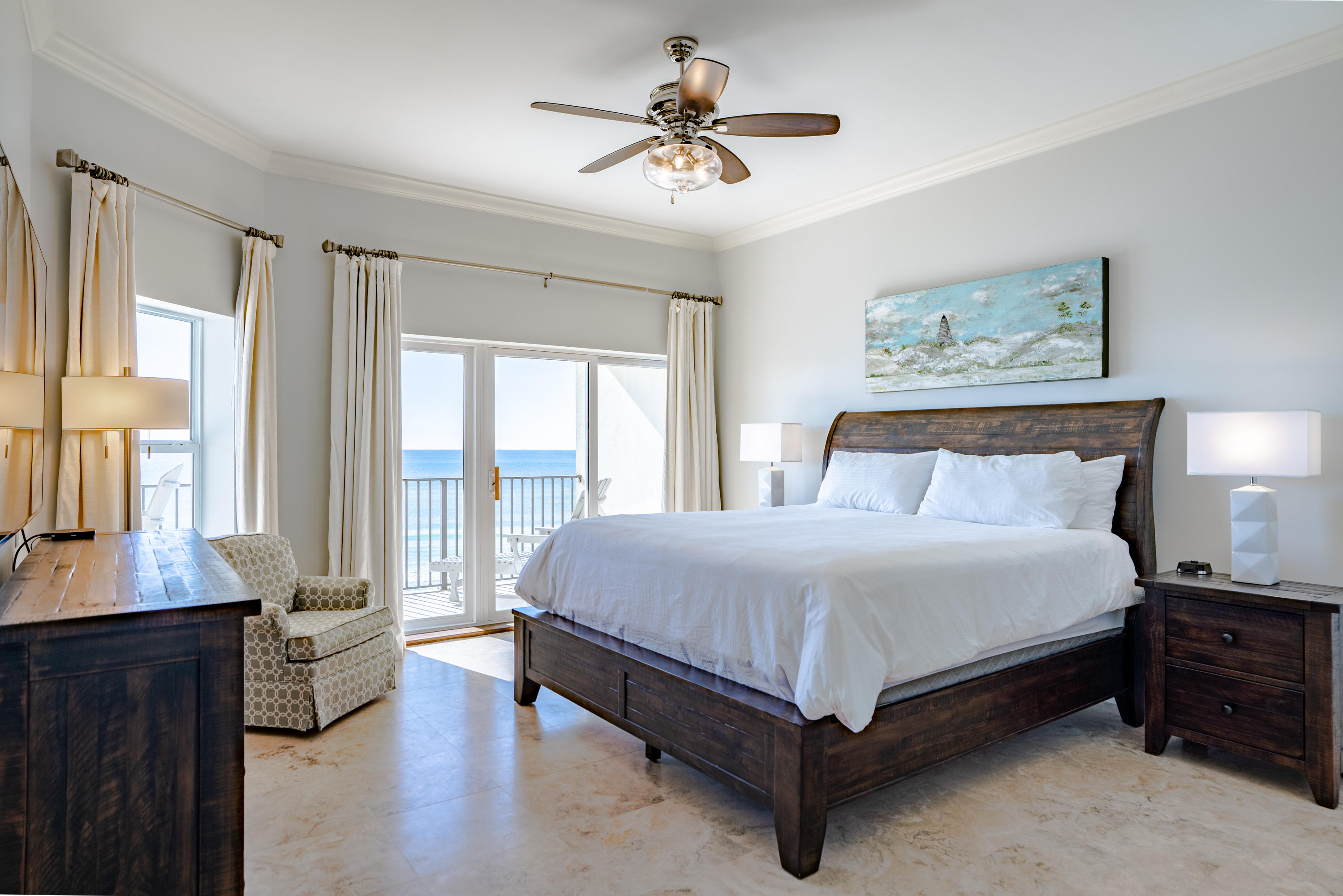3880 East County Highway 30A, Unit 402 Santa Rosa Beach, FL 32459 - Photo 5 of 62 a spacious bedroom with a large bed and a chandelier