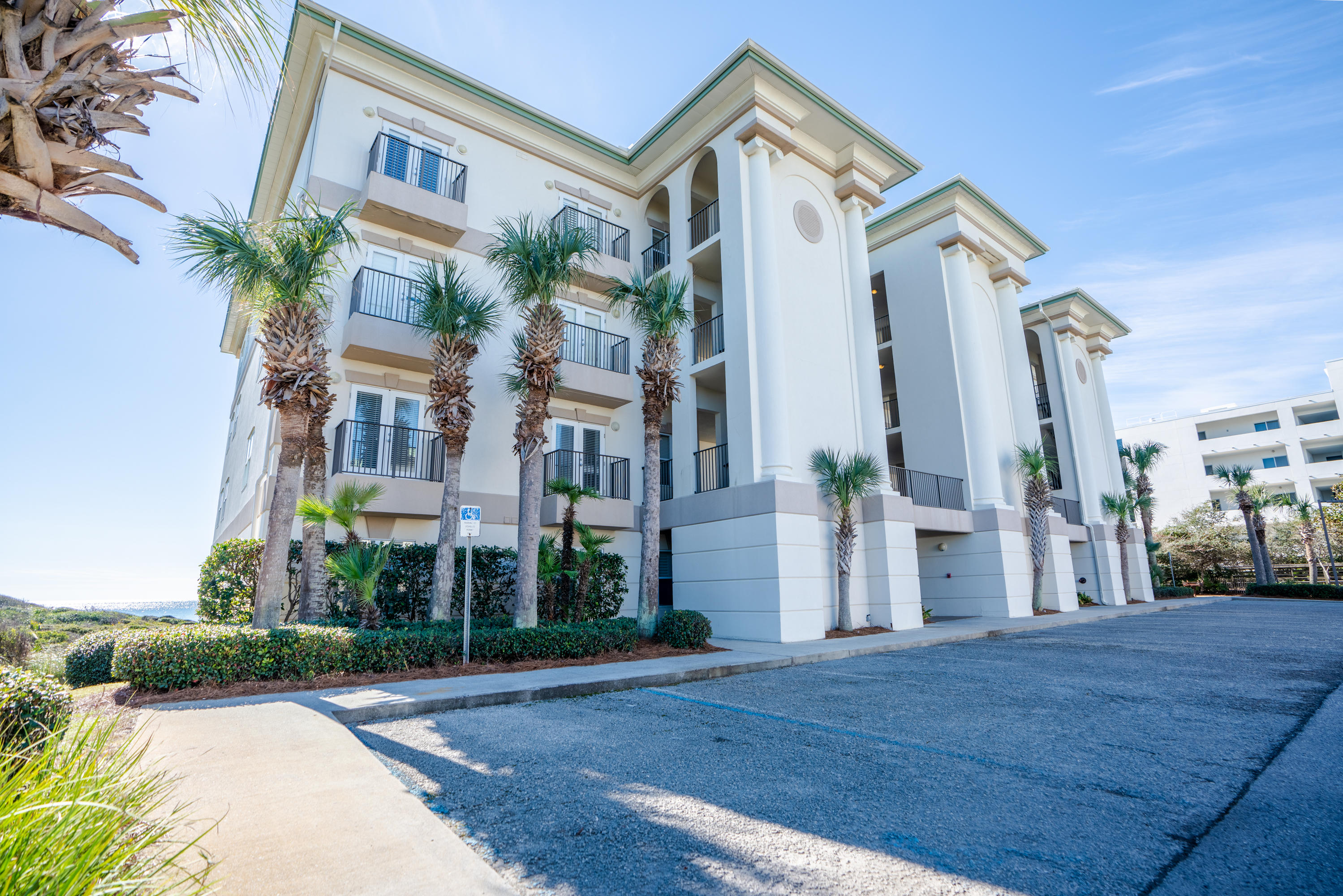 3880 East County Highway 30A, Unit 402 Santa Rosa Beach, FL 32459 - Photo 61 of 62 a view of a building with a yard