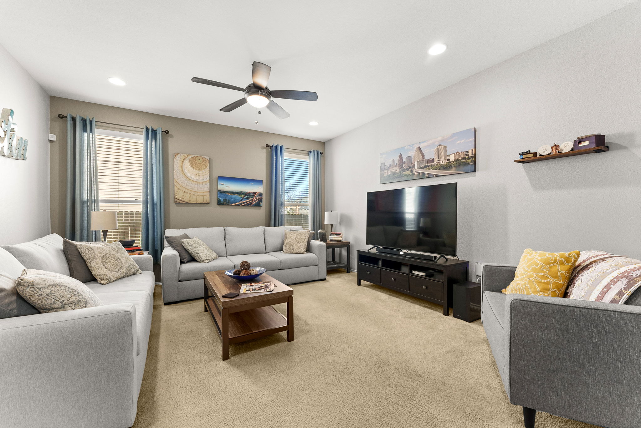 11209 Kildoon Drive Austin, TX 78754 - Photo 33 of 37 Living room with recessed lighting, a ceiling fan, open floor plan to kitchen and dining area.