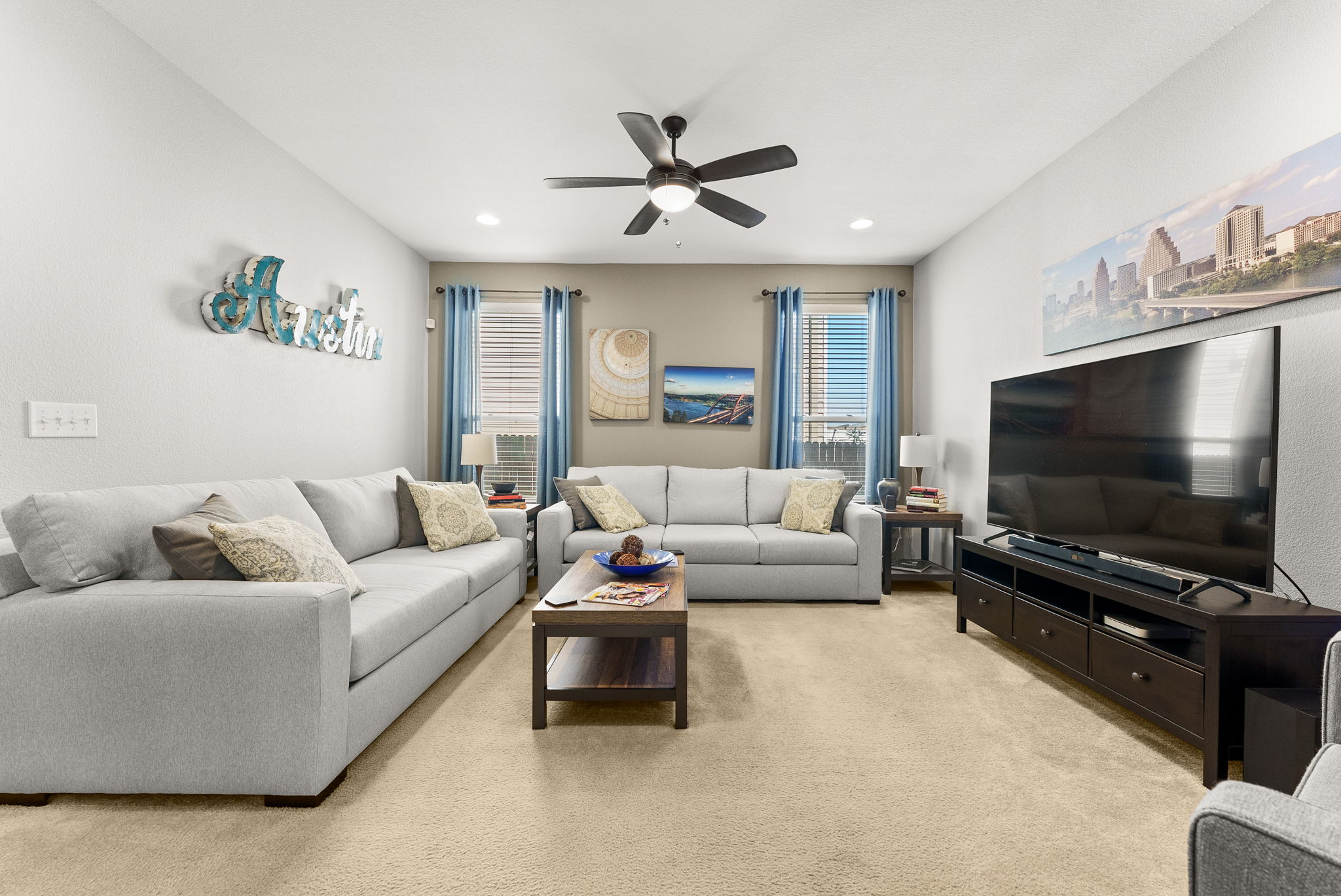 11209 Kildoon Drive Austin, TX 78754 - Photo 34 of 37 Living room with recessed lighting, a ceiling fan, open floor plan to kitchen and dining area.