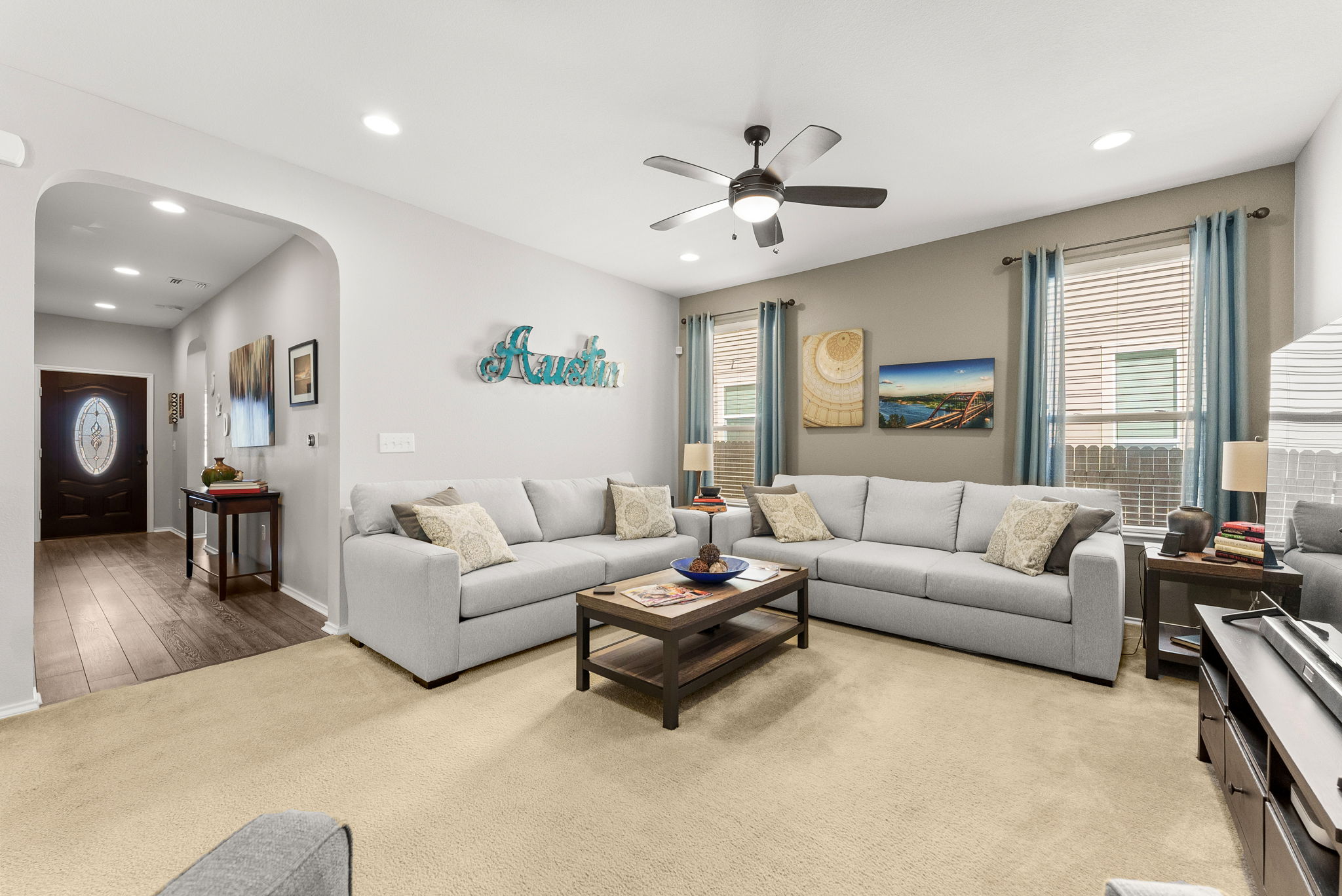 11209 Kildoon Drive Austin, TX 78754 - Photo 35 of 37 Living room with recessed lighting, a ceiling fan, open floor plan to kitchen and dining area.