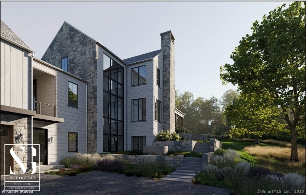 382 North Street Greenwich, CT 06830 - Photo 16 of 18 a view of a brick house next to a yard