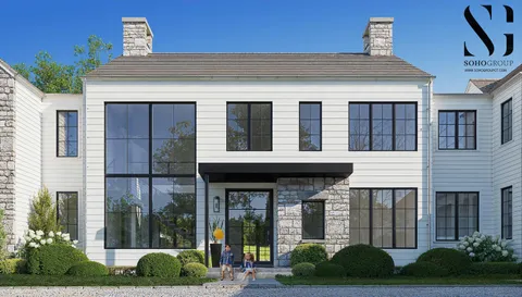 a view of brick building with a yard