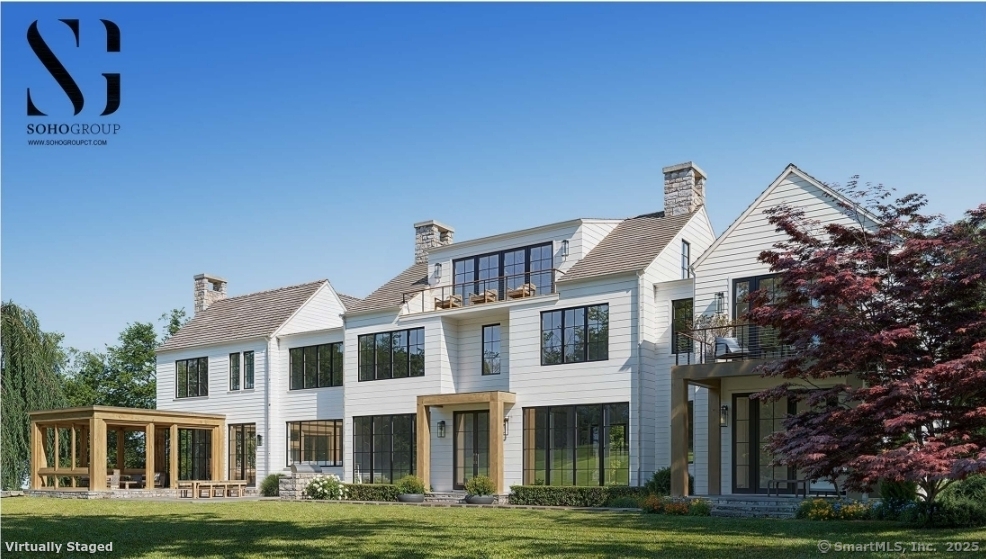 382 North Street Greenwich, CT 06830 - Photo 4 of 18 a front view of a building with a garden