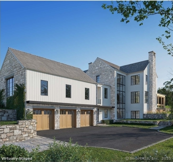 382 North Street Greenwich, CT 06830 - Photo 5 of 18 a front view of a house with a yard