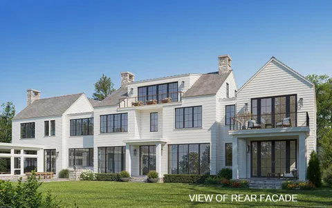 a front view of a residential apartment building with a yard