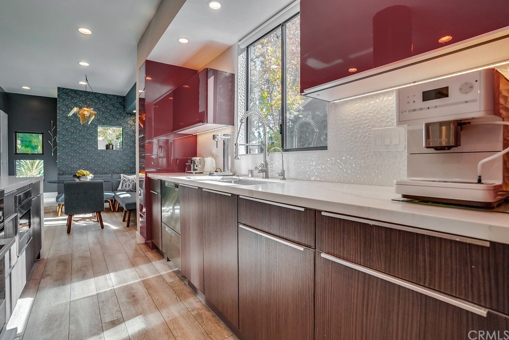 1051 Prospect Avenue Long Beach, CA 90804 - Photo 11 of 56 a kitchen with stainless steel appliances granite countertop a sink and cabinets