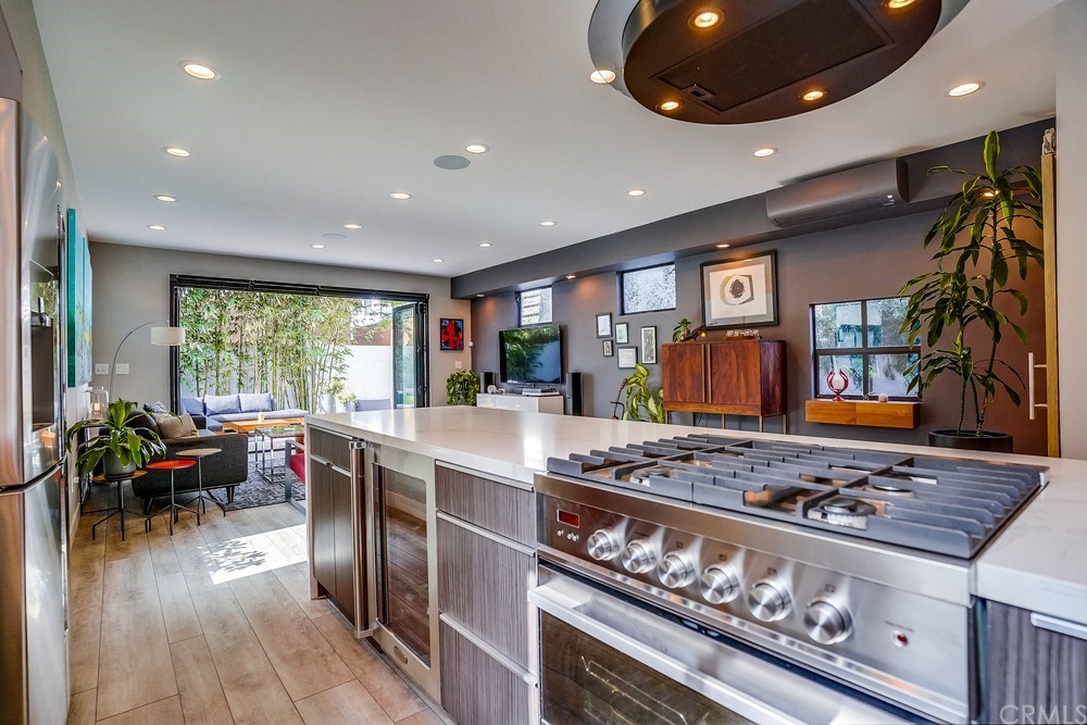 1051 Prospect Avenue Long Beach, CA 90804 - Photo 16 of 56 a kitchen with stainless steel appliances granite countertop a stove and a refrigerator