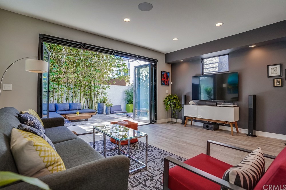 1051 Prospect Avenue Long Beach, CA 90804 - Photo 19 of 56 a living room with furniture and a flat screen tv