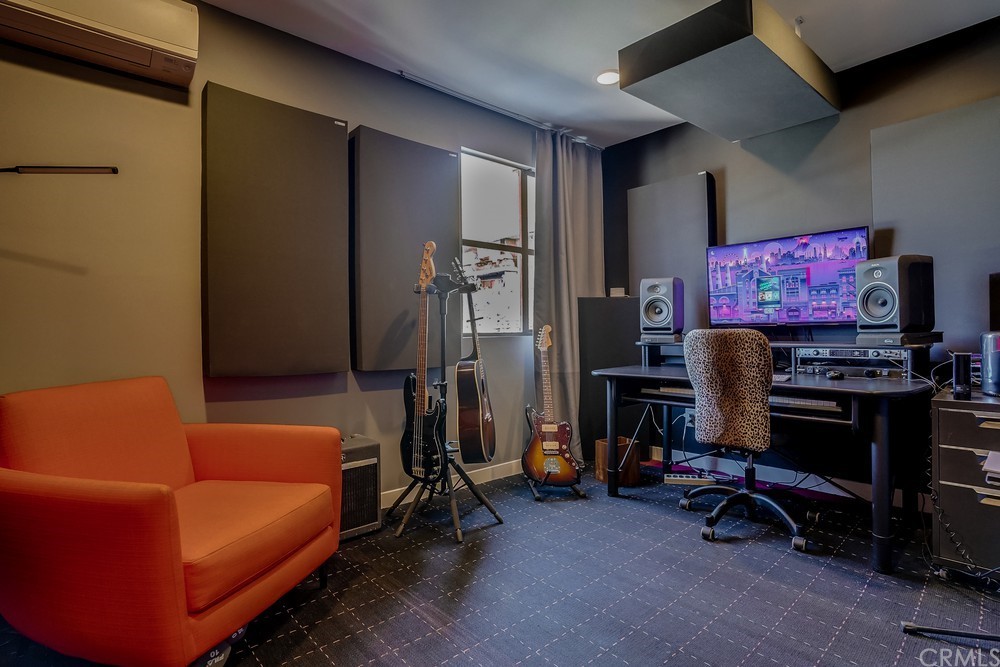 1051 Prospect Avenue Long Beach, CA 90804 - Photo 39 of 56 a living room with furniture and a flat screen tv