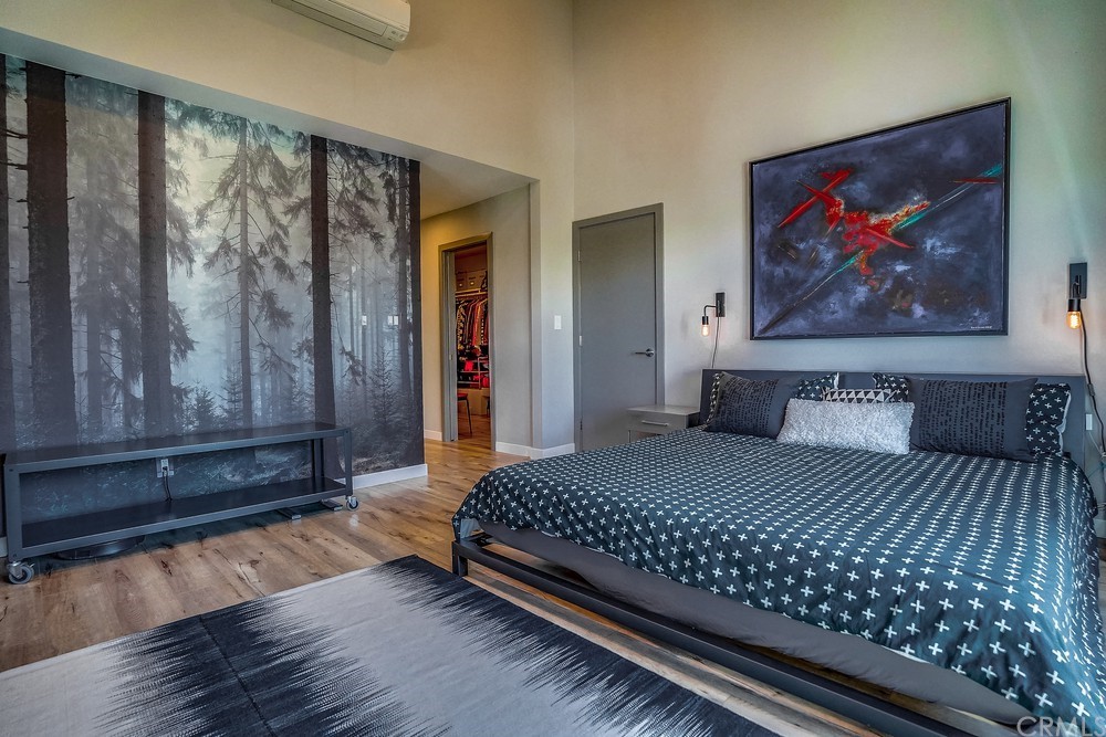 1051 Prospect Avenue Long Beach, CA 90804 - Photo 42 of 56 a bedroom with a bed and wooden floor