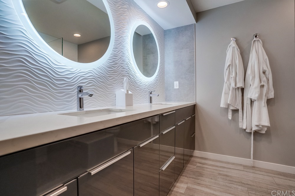 1051 Prospect Avenue Long Beach, CA 90804 - Photo 47 of 56 a bathroom with a double vanity sink and mirror