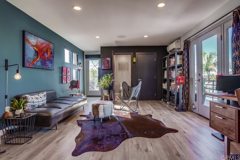 1051 Prospect Avenue Long Beach, CA 90804 - Photo 49 of 56 a living room with furniture and a flat screen tv