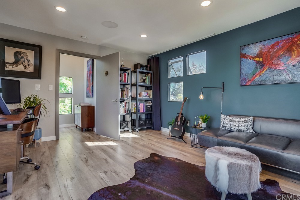 1051 Prospect Avenue Long Beach, CA 90804 - Photo 51 of 56 a living room with furniture and a wooden floor