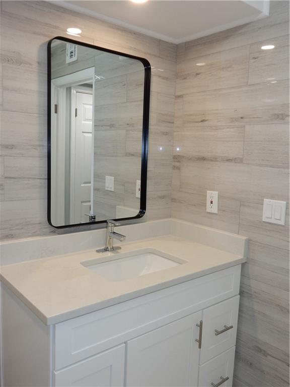 3083 Colonial Way, Unit N Atlanta, GA 30341 - Photo 11 of 20 a bathroom with a sink a vanity and a mirror