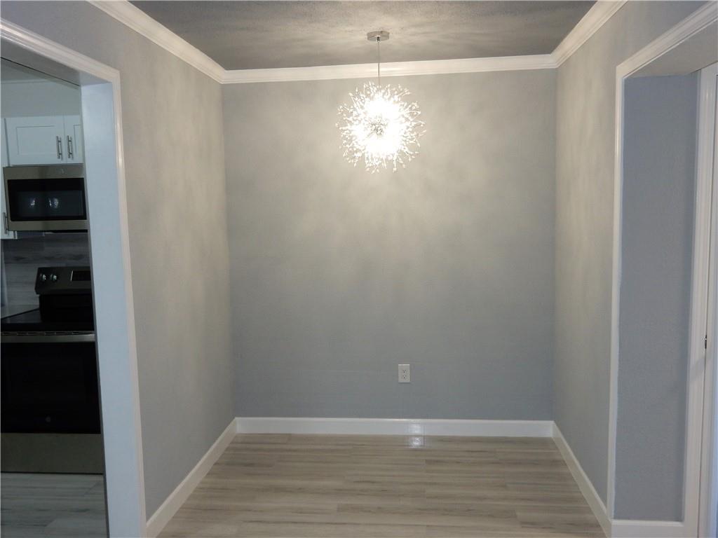3083 Colonial Way, Unit N Atlanta, GA 30341 - Photo 9 of 20 a view of room with window and hardwood floor
