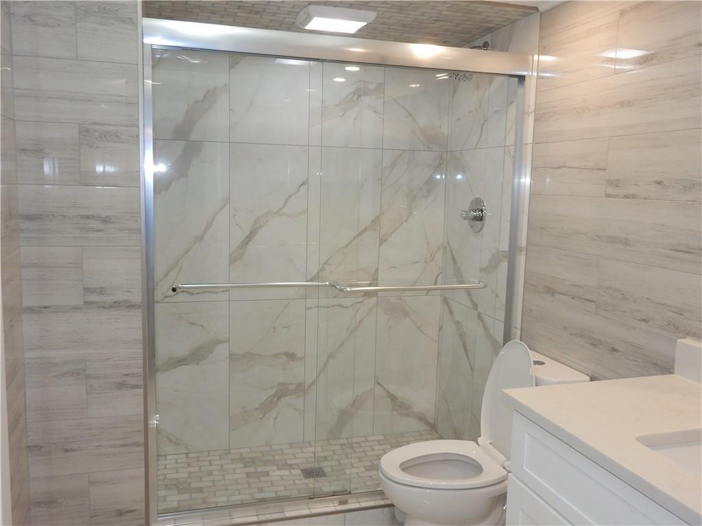 3083 Colonial Way, Unit N Atlanta, GA 30341 - Photo 10 of 20 a bathroom with a toilet and a shower