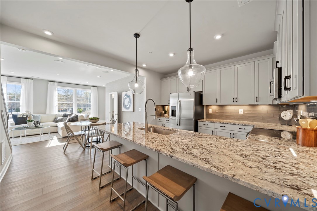 13121 Brattice Loop Midlothian, VA 23114 - Photo 2 of 43 a large kitchen with a table and chairs